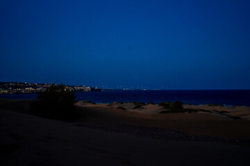 Sunset, Moon and Evening Sky over Maspalomas on Gran Canary Island Spain.