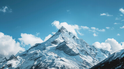 Sunlit Alpine Peaks, Snowy Mountains and Blue Skies with white clouds