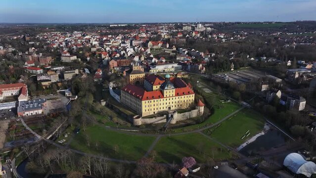 Flight around the Zeitz castle park. The historic old town in the background. Moritzburg Castle dominates the skyline. Small town in Saxony-Anhalt.