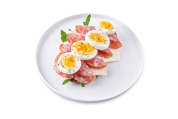 Salami sausages arugula cheese egg rye bread sandwich on a white isolated background