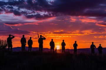 Fototapeta premium A group of individuals standing on the grass covered field, enjoying the view and engaging in conversation, A military salute in front of a Memorial Day dawn, AI Generated
