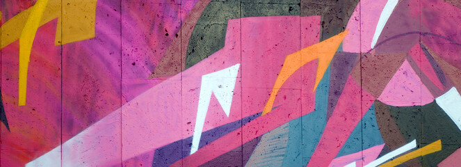 Colorful background of graffiti painting artwork with bright aerosol outlines on wall. Old school...