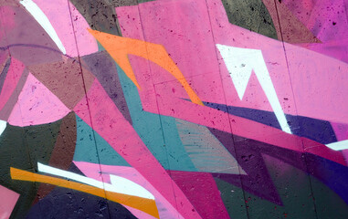 Colorful background of graffiti painting artwork with bright aerosol outlines on wall. Old school...