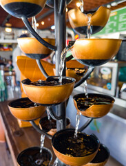 Cascading cup fountain for indoors or outdoors