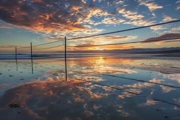 Beach Volleyball Net on Sand With Sunset in Background, A picturesque coastal volleyball court at...