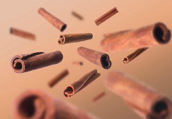 Aromatic dry cinnamon sticks on brown background