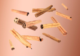 Aromatic dry cinnamon sticks on brown background