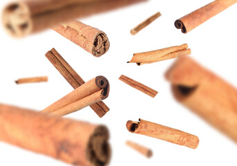Aromatic dry cinnamon sticks on white background