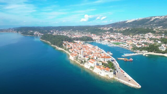 Behold the enchanting beauty of the historic town of Rab, nestled on the picturesque island of Rab in Croatia сaptured from a drone