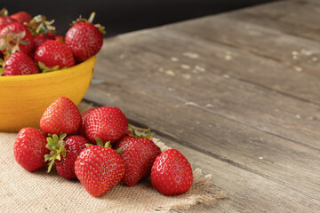 Berries of ripe, juicy strawberries. Fresh strawberries. Close-up. Wooden, rustic background. Copy space