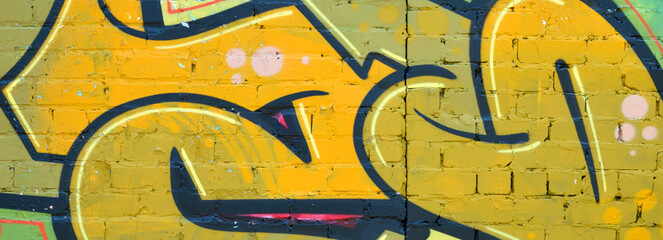 Colorful background of graffiti painting artwork with bright aerosol outlines on wall. Old school...