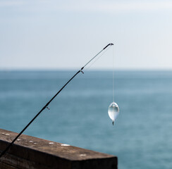 fishing rod and reel on the pier