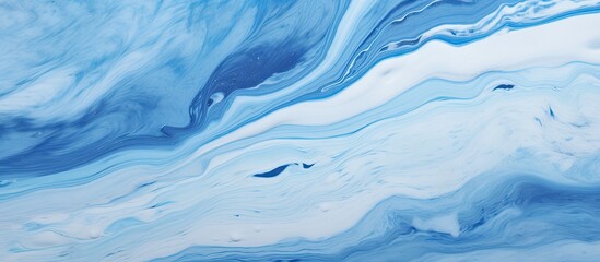 A detailed close up of a liquid blue and white marble texture resembling wind waves in an azure...