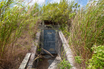 Heavy steel door protecting abandoned underground bunker