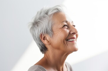 Graceful Aging: Serene Elderly Woman with a Contemplative Joyful Smile