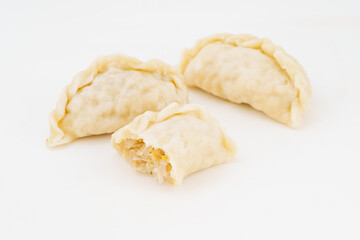 Northeastern large dumplings with vegetarian stuffing on white background