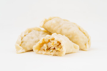 Northeastern large dumplings with vegetarian stuffing on white background