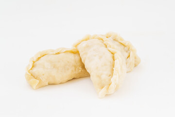 Northeastern large dumplings with vegetarian stuffing on white background