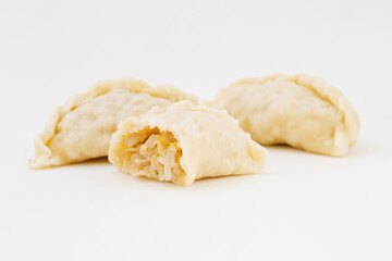 Northeastern large dumplings with vegetarian stuffing on white background