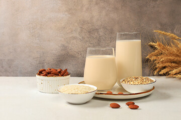 Vegan alternative milk lactose and gluten free, allergy free, almonds, rice, oats and glasses of...