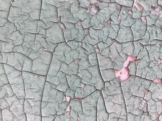 Old wall with peeling green paint