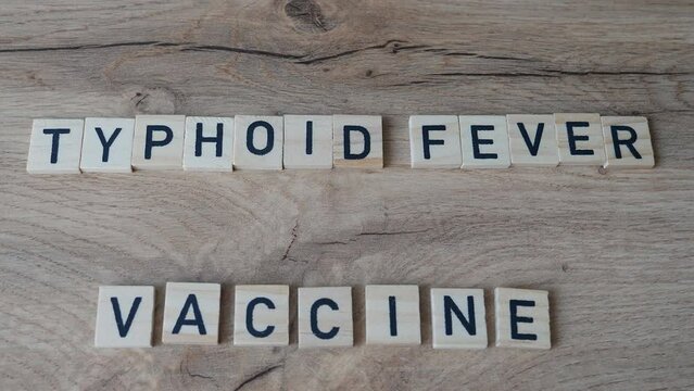 Typhoid Fever Vaccination concept. Vaccine for travellers traveling to a country where typhoid Salmonella serotype Typhi bacteria is common.