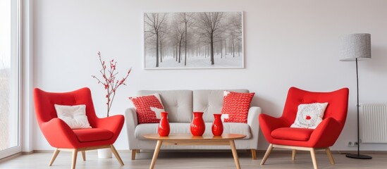 Red armchairs and lamp in contemporary Scandinavian living room.