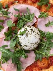 pizza topping: ham, mozzarella ball and arugula