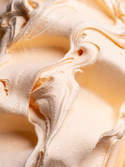 Frozen Tangerine flavour gelato - full frame detail. Close up of a orange color surface texture of mandarine Ice cream.
