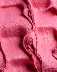 Frozen Strawberry flavour gelato - full frame detail. Close up of a pink surface texture of Ice cream.