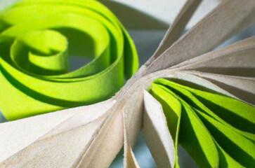 Quilling from white and green paper, close-up