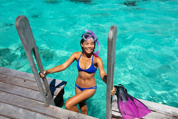 Travel Vacation Snorkeling. Snorkel swim woman in tropical coral reef resort. This image is completely unretouched and unedited and model is with no makeup. Authentic real people. Original Raw Image - 761733713