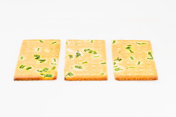 Chive biscuits on white background