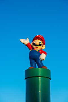 Kungsbacka, Sweden - January 30 2022: Mario figure on green pipe in susnet.