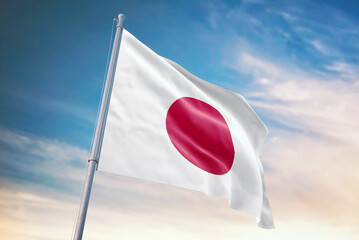 Waving flag of Japan in blue sky. Japan flag for independence day. The symbol of the state on wavy fabric.