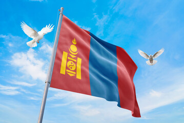Waving flag of Mongolia in beautiful sky and flying pigeons. Mongolia flag for independence day. The symbol of the state on wavy fabric.