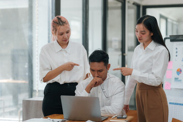 Overwhelmed businessman with too much work while two colleagues are scolding. High-pressure job and deadline stress concept.