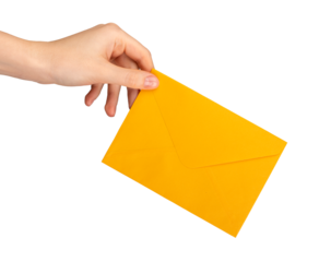 A hand holding a yellow orange envelope