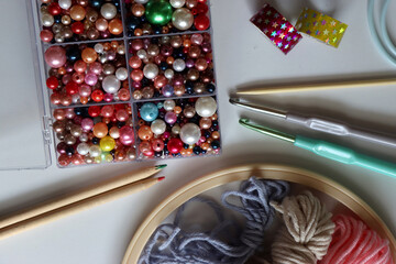 Various craft supplies on white background. Supplies for jewelry making, drawing and needlework. Flat lay.