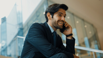 Smart business man calling phone to manager while discuss about business plan. Skilled executive...