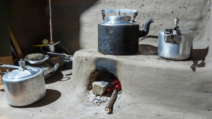 Typical cooking zone with a kettle and a pressure cooker in a lodge kitchen in the Kangchenjunga region in Nepal on the way to the Kangchenjunga Base Camp - 761750998
