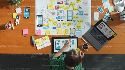 Top view of business woman looking and working at Ux Ui design. Top down aerial view of project...