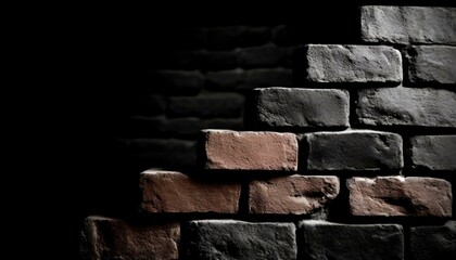 red brick wall stands out against a stark black backdrop, creating a striking contrast. The texture...