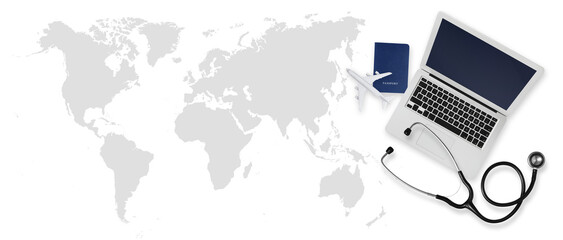 Top view of a passport with airplane, computer and a stethoscope on world map background, medical insurance travel concept whether it's a summer beach vacation or a business trip. Health and safety