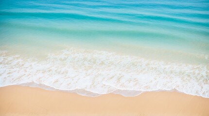 Fototapeta na wymiar Easy waves softly touch the sandy beach under a clear sky 