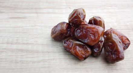 Dates fruit on wooden table. Top view with copy space.