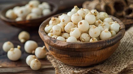 Deurstickers Makhana, commonly known as fox nuts or lotus seeds, are nutritious seeds harvested from the Euryale ferox plant, a member of the water lily family, predominantly grown in Asian wetlands and ponds. © TensorSpark