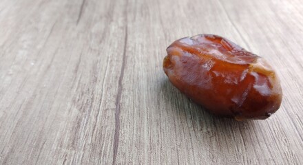 Dates fruit on wooden table. Top view with copy space.