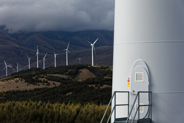 Wind farm or wind park at sunset located in the mountains of Italy Europe to realize clean energy....