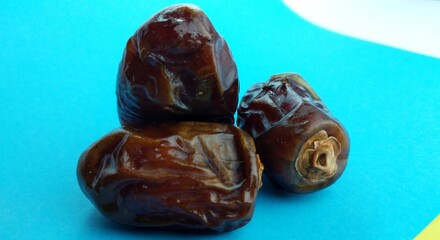 Dates on a blue background. Close-up. Food background.